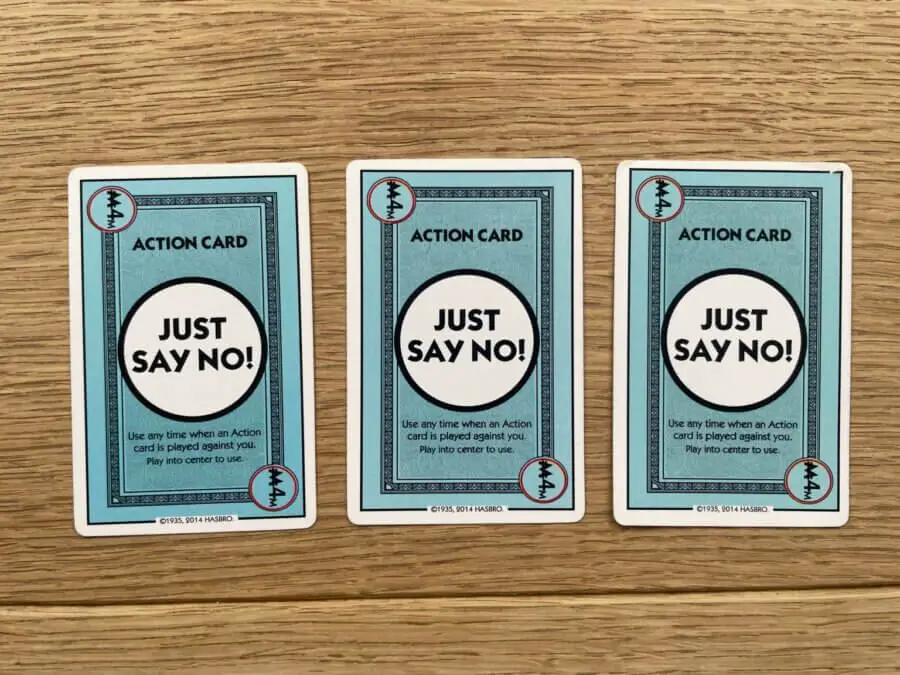 The three "Just Say No!" cards placed down on a wooden table