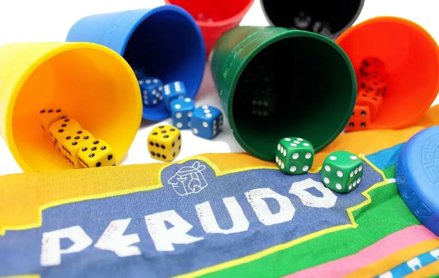 Perudo dice game showing 6 coloured cups and dice