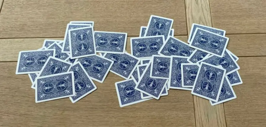 Scattered draw pile of cards on the table in a game of Go Fish